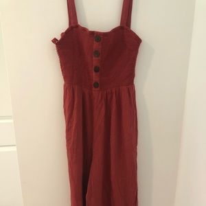 Red jumpsuit, button detail